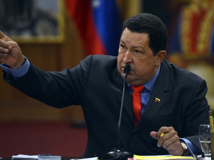 Venezuelan President Hugo Chavez gestures during a press conference in Caracas on October 9, 2012. Chavez pledged to become a "better president" and work with the opposition after winning a tough re-election battle that betrayed simmering discontent at his socialist revolution. After almost 14 years in power, Chavez survived cancer and the most formidable opponent of his presidency, youthful business leader and former state governor Henrique Capriles, to win another six-year term. AFP PHOTO/JUAN BARRETO