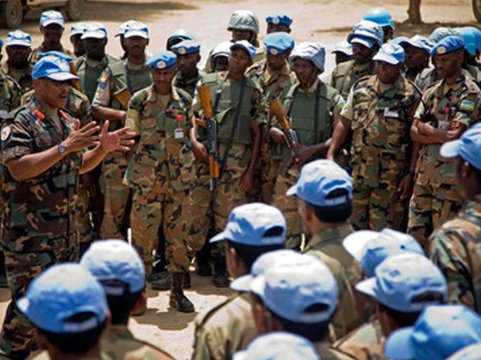 A UNAMID handout photo released on 22 June 20102 shows UNAMID Force Commander, Lieutenant General Patrick Nyamvumba (L), speaks to UN soldiers during his visit at the Nertiti UNAMID Camp Site, West Darfur. Nyamvumba his visiting to get information about the ambush where three peacekeepers from Rwandan were killed and one seriously wounded in an armed confrontation while they were providing security to engineers working on a new team site. EPA/ALBER GONZALEZ FARRAN / UNAMID HANDOUT EDITORIAL USE ONLY