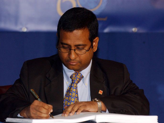 epa00528861 Maldives Minister of Foreign Affairs Ahmed Shaheed signs the International Convention for the Suppression of Acts of Nuclear Terrorism treaty prior to the opening session of the World Summit of the United Nations at UN headqiarters in New York City Wednesday 14 September 2005. The three day summit is the largest gathering of world leaders in history. EPA/KEITH BEDFORD