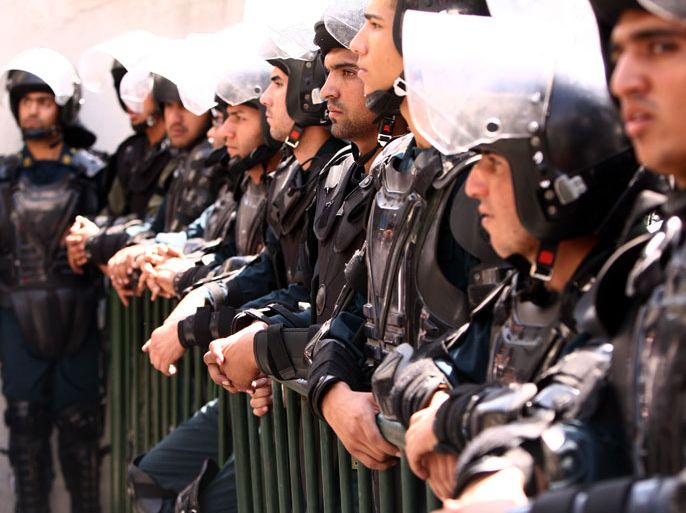 epa03396517 Iranian riot-police stand guard in front of the US interest section within the Swiss embassy in Tehran, Iran, on 13 September 2012 as some 500 Iranian Islamists gather in protest at a film deemed offensive to Prophet Mohammed by American-Israeli director Sam Bacile. The Swiss embassy was heavily protected by hundreds of police and anti-riot forces for avoiding any storming of the embassy by the angry Islamists. The crowd shouted Death to US and Death to Israel, Hollywood has become centre of Zionists (Israel), and demanded the hanging of filmmaker Bacile. EPA/ABEDIN TAHERKENAREH