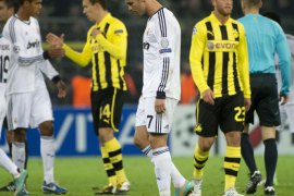 Real Madrid's Portuguese forward Cristiano Ronaldo (C) leaves the pitch at the end of the UEFA Champions League Group D football match BVB Borussia Dortmund vs Real Madrid in Dortmund, western Germany on October 24, 2012. Dortmund won the match 2-1. AFP PHOTO / ODD ANDERSEN