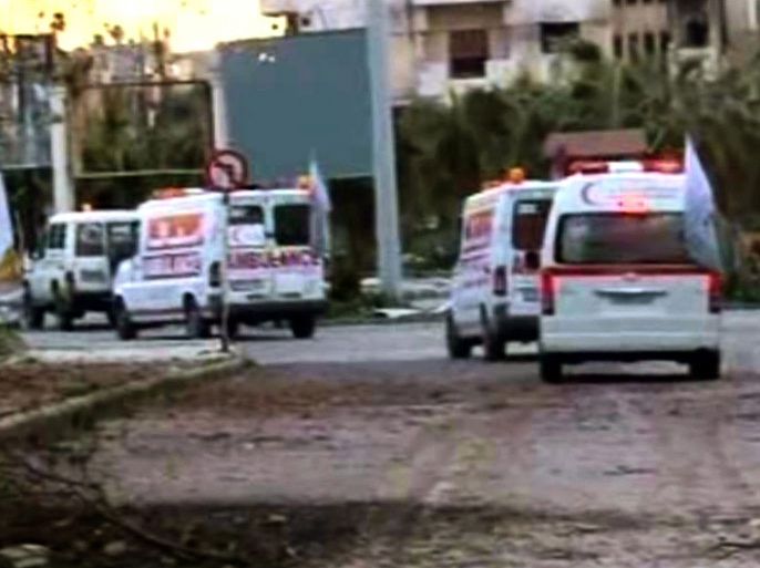 A Syrian TV video grab released by released by the official Syrian Arab News Agency (SANA) on 25 February 2012, shows Syrian Red Crescent ambulances in the besieged city of Homs, Syria, 24 February 2012. According to SANA, Syrian Red Crescent ambulances had access to the neighborhood of Baba Amr on 24 February and tranferred a number of wounded people for treatment at Homs hospitals. EPA/SANA HANDOUT