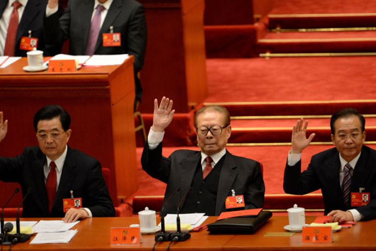 Chinese President Hu Jintao, former president Jiang Zemin and Chinese Prime Minister Wen Jiabao vote at the closing of the 18th Communist Party Congress at the Great Hall of the People in Beijing on 14 November 2012. The week-long Communist Party Congress will end with a transition of power to Chinese Vice President Xi Jinping, who will govern for the coming decade amid growing pressure for reform of the communist regime's iron-clad grip on power