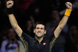 Serbia's Novak Djokovic celebrates beating Czech Republic's Tomas Berdych during their group A singles match in the round robin stage on the fifth day of the ATP World Tour Finals tennis tournament in London on November 9, 2012. AFP PHOTO / GLYN
