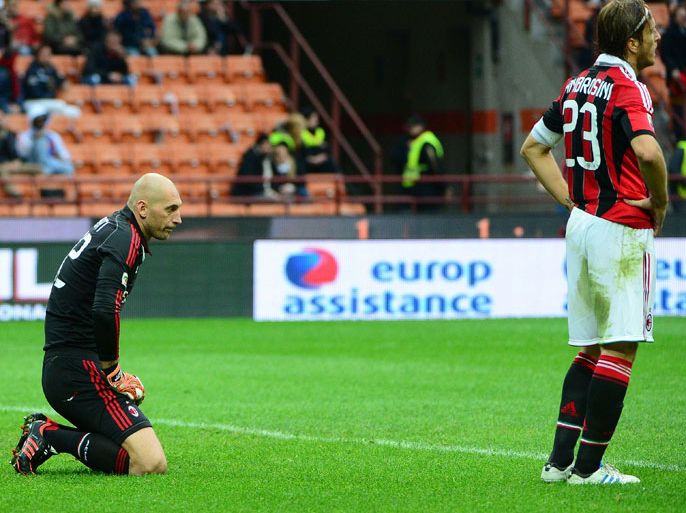 AC Milan's goalkeeper Chistian Abbiati (L) reacts after taking a second goal during the serie A football match between AC Milan and Fiorentina on November 11, 2012 at the San Siro stadium in Milan. AFP PHOTO / OLIVIER MORIN