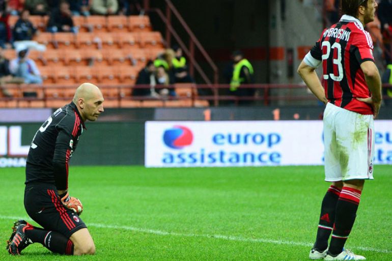AC Milan's goalkeeper Chistian Abbiati (L) reacts after taking a second goal during the serie A football match between AC Milan and Fiorentina on November 11, 2012 at the San Siro stadium in Milan. AFP PHOTO / OLIVIER MORIN