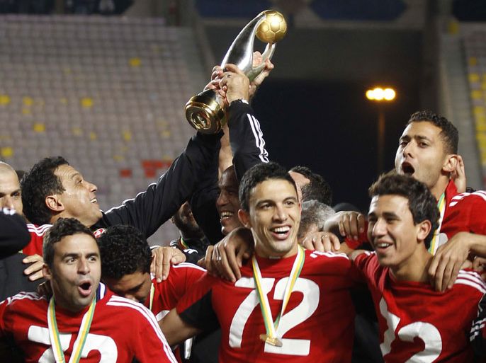 Egypt's Al Ahli Players celebrate winning their African Champions League (CAF) after their final soccer match against Tunisia's Esperance Sportive de Tunis at the Rades stadium in Tunis, November 17, 2012. Goals from Mohamed Nagui and Walid Soliman handed Egypt's Al Ahli the African Champions League crown on Saturday following a 2-1 away win over holders Esperance of Tunisia. REUTERS/Zoubeir Souissi (TUNISIA - Tags: SPORT SOCCER)