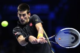 Serbia's Novak Djokovic return during his victory over Britain's Andy Murray in their group A singles match in the round robin stage on the third day of the ATP World Tour Finals tennis tournament in London on November 7, 2012. Djokovic won 4-6, 6-3, 7-5. AFP PHOTO / GLYN KIRK