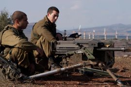 Israeli soldiers stands in an abandoned military outpost overlooking the ceasefire line between Israel and Syria on Tal Hazika near Alonei Habshan in the Israeli-occupied Golan Heights on November 15, 2012. Gunfire from Syria hit the Israeli-occupied Golan Heights morning, the Israeli military said, in the latest spillover of violence from the bloody civil war raging across the ceasefire line