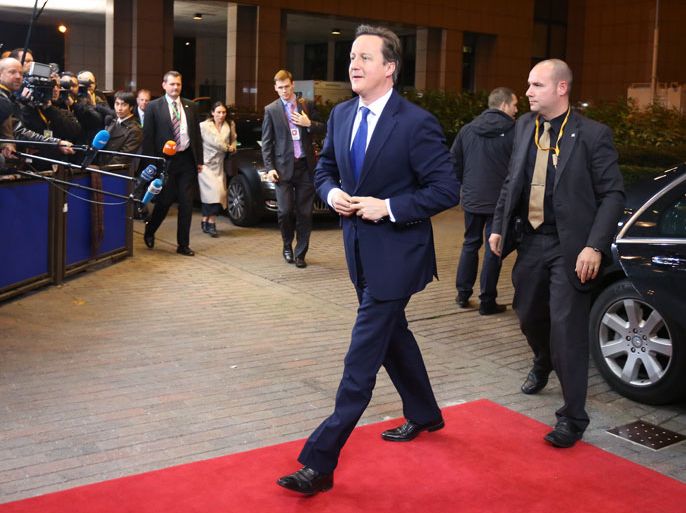 epa03482030 British Prime Minister David Cameron (C) arrives for a meeting with the President of the European Council, Herman Van Rompuy, ahead of the European summit at the EU headquarters in Brussels, Belgium, 22 November 2012. The budget summit in Brussels is taking place against a backdrop of growing tensions between EU member states over the Brussels-based bloc's budget plans, which cover the 2014-2020 period. The 2014-20 budget - technically known as the multi-annual financial framework or MFF - will set maximum spending limits, as well as define where the money should go and where it should come from. EPA/JULIEN WARNAND