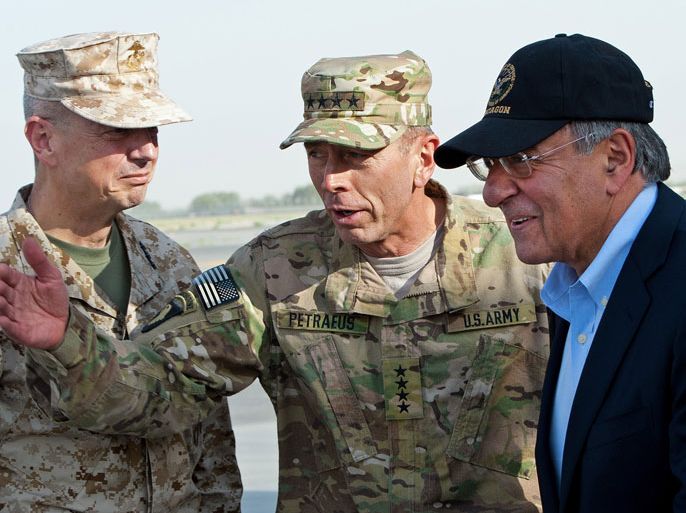 Kabul, -, AFGHANISTAN : (FILES) In this photograph taken on July 9, 2011, US General John Allen (L) and General David Petraeus (C) greet US Secretary of Defence Leon Panetta (R) as he lands in Kabul. The US commander in Afghanistan, General John Allen, is under investigation for "inappropriate" emails to a woman linked to the sex scandal involving former CIA director David Petraeus, a defense official said November 13, 2012. The revelation represented yet another stunning turn in a widening scandal that has jolted Washington only days after the re-election of President Barack Obama, with lawmakers vowing to get to the bottom of case. AFP PHOTO/POOL/PAUL J. RICHARDS/FILES