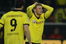 Dortmund's Polish defender Lukasz Piszczek reacts after the German first division Bundesliga football match Borussia Dortmund vs Fortuna Duesseldorf, in Dortmund, western Germany, on November 27, 2012. AFP PHOTO / PATRIK STOLLARZ