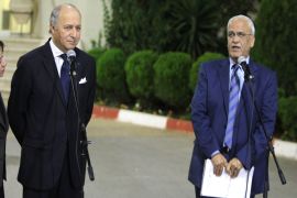 AM96 - RAMALLAH, WEST BANK, - : Saeb Erekat (R), the chief Palestinian negotiator, speaks as French Foreign Minister Laurent Fabius listens on, during a joint press conferencem in the West Bank city of Ramallah, hours after Fabius meet with Israeli President Shimon Peres on November 18, 2012, to discuss the ongoing fighting between the Israeli army and Hamas militants in the Gaza Strip. AFP PHOTO / ABBAS MOMANI
