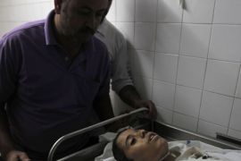 The body of Hmeid Abu Daqqa, 13, is pictured at the morgue of a hospital in Khan Yunis, in the southern Gaza Strip on November 8, 2012