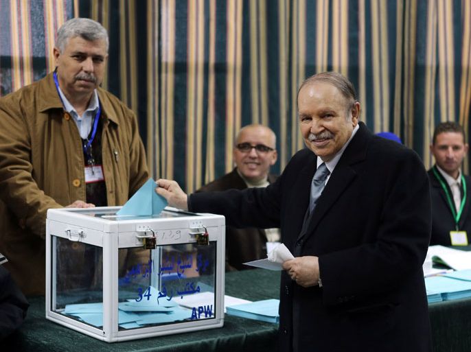 Algiers, -, ALGERIA : Algeria's president Abdelaziz Bouteflikacasts his ballot at a polling station in Algiers during municipal and regional assemblies elections on November 29, 2012. Algeria's ruling party, National Liberation Front (FLN), is eyeing a landslide victory in local elections, with numerous opposition groups warning of fraud in a poll that could struggle to mobilise a disaffected electorate. AFP PHOTO