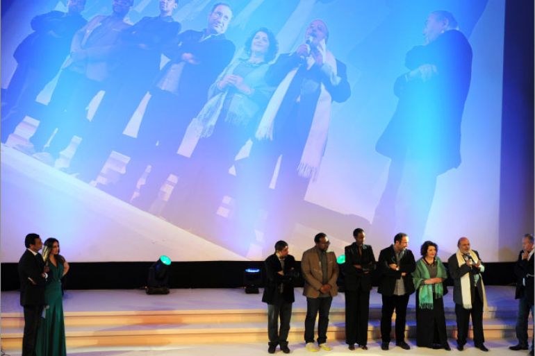 Carthage jury president and Tunisian screenwriter Ali Louati (2nd R) presents jury members during the opening night of the 24th session of the "Journées Cinematographiques de Carthage" (JCC) film festival on November 16, 2012, in Tunis. AFP PHOTO / FETHI BELAID