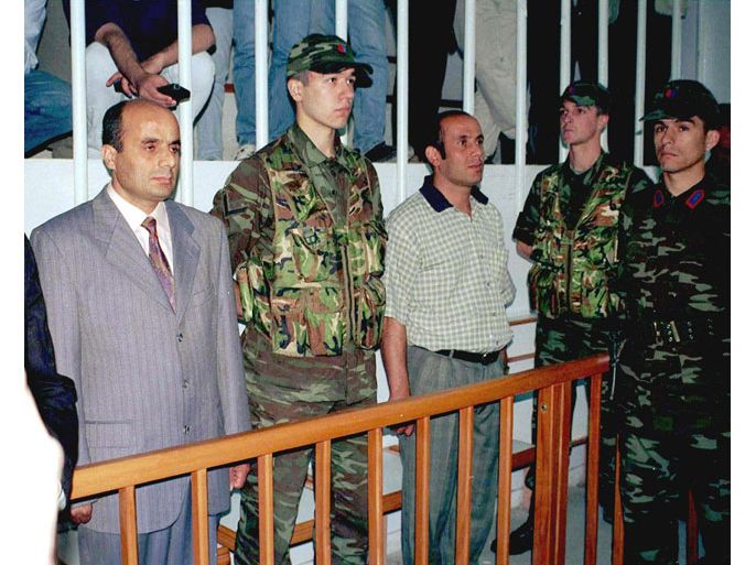 DIY01-19990520-DIYARBAKIR, TURKEY: Former right-hand man of captured PKK leader Abdullah Ocalan, Semdin Sakik (L), and his brother Arif (3rdR) stand at court in Diyarbakir on Thursday 20 May 1999. SEMDIN Sakik has been charged with treason and activities aimed at dividing the country and was sentenced to death at a trial widely seen as a rehearsal for the Kurdish rebel leader. Arif Sakik was also sentenced to death under those charges. EPA PHOTO HURRIYET/STR/AYK-fob