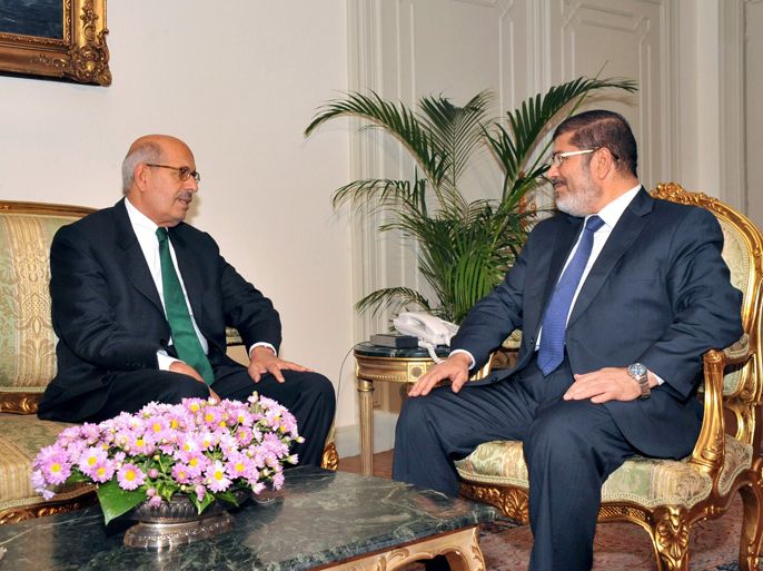A handout picture released by the Egyptian presidency shows Egyptian President Mohamed Morsi (R) meeting with former UN nuclear watchdog chief Mohamed ElBaradei at the presidential palace in Cairo on November 13, 2012. AFP PHOTO/HO/EGYPTIAN PRESIDENCY