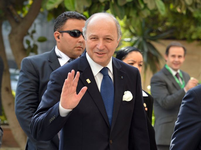 French Foreign Minister Laurent Fabius waves as he arrives for the ministerial meeting of the Arab League and European Union in the Arab League headquarters in Cairo on November 13, 2012. France will support a new Syrian opposition bloc, Fabius said after talks with its leaders in Cairo