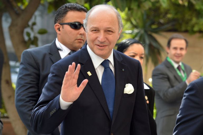 French Foreign Minister Laurent Fabius waves as he arrives for the ministerial meeting of the Arab League and European Union in the Arab League headquarters in Cairo on November 13, 2012. France will support a new Syrian opposition bloc, Fabius said after talks with its leaders in Cairo