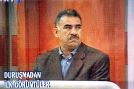 An image taken off TV screen from Turkish TRT TV station showing Abdullah Ocalan, leader of the rebel Kurdistan Workers Party PKK, sitting in a bullet-proof glas case during his trial at the military prison at Imrali island off Turkish coast, Monday, 31 May 1999. A Turkish State Security Court trying Ocalan today rejected a request by defence attorneys to adjourn the trial, the Anatolia news agency said. Ocalan went on trial today