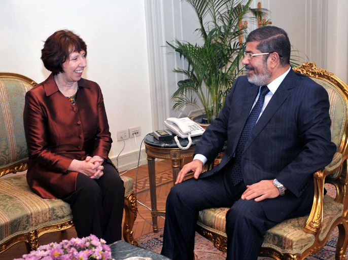 epa03470222 A Handout photograph released by the Egyptian Presidency shows Egyptian President Mohamed Morsi (R) talking with EU High Representative Catherine Ashton during a meeting at the Presidential Palace in Cairo, Egypt, 14 November 2012. Ashon visit follows an Arab League and European Union Foreign Ministers meeting held a day earlier in Cairo. EPA/EGYPTIAN PRESIDENCY/HANDOUT HANDOUT EDITORIAL USE ONLY/NO SALES