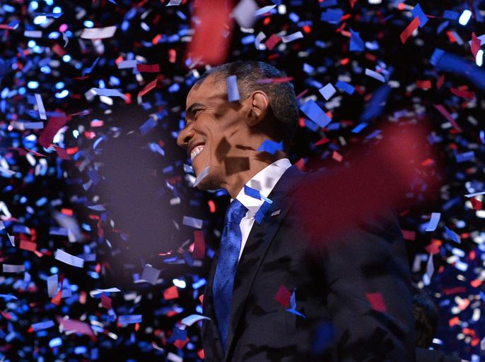 US President Barack Obama celebrates after delivering his acceptance speech ion Chicago on November 7, 2012. Obama swept to re-election, forging history again by transcending a slow economic recovery and the high unemployment which haunted his first term to beat Republican Mitt Romney