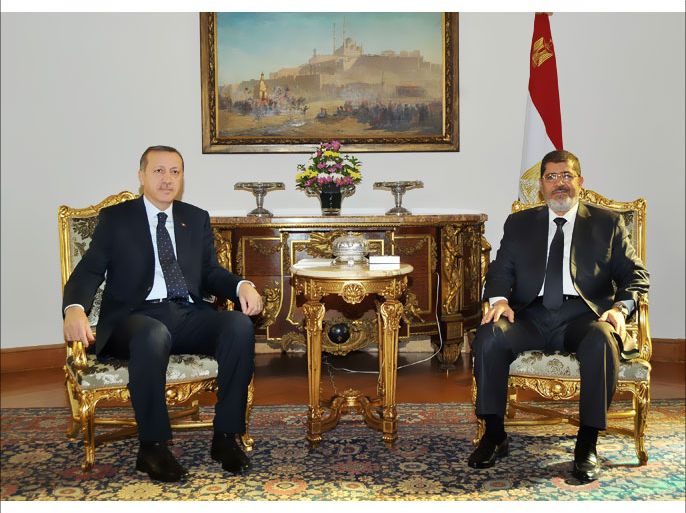 A handout picture released by the Egyptian presidency shows Turkey's Prime Minister Recep Tayyip Erdogan (L) meeting with Egyptian President Mohamed Morsi at the presidential palace in Cairo on November 17, 2012. Erdogan arrived in Egypt for a visit overshadowed by an Israeli aerial assault on neighbouring Gaza strongly condemned by both Ankara and Cairo. AFP PHOTO/HO/EGYPTIAN PRESIDENCY
