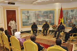 Malian Foreign minister Tieman Coulibaly (Top 3rd R) speaks with Burkina Faso President and mediator in the Mali crisis, Blaise Compaore, during a meeting on December 3, 2012 in Ouagadougou. Burkina Faso President Blaise Compaore, west Africa's chief mediator for the crisis in Mali, held his first joint meeting Tuesday with delegations from the Malian government and armed groups Ansar Dine and the MNLA, his office said. AFP