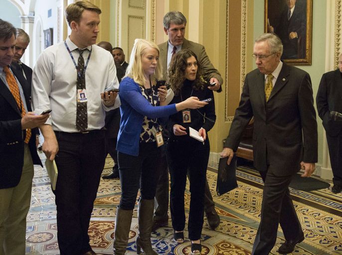 WASHINGTON, DC - DECEMBER 30: Senate Majority Leader Harry Reid (D-NV) (R) leaves the Senate Chamber, on Capitol Hill, on December 30, 2012 in Washington, DC. The House and Senate are both in session today to deal with the looming 'fiscal cliff.' issue. Drew Angerer/Getty Images/AFP== FOR NEWSPAPERS,
