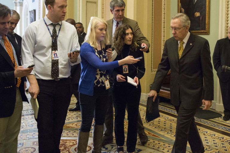 WASHINGTON, DC - DECEMBER 30: Senate Majority Leader Harry Reid (D-NV) (R) leaves the Senate Chamber, on Capitol Hill, on December 30, 2012 in Washington, DC. The House and Senate are both in session today to deal with the looming 'fiscal cliff.' issue. Drew Angerer/Getty Images/AFP== FOR NEWSPAPERS,