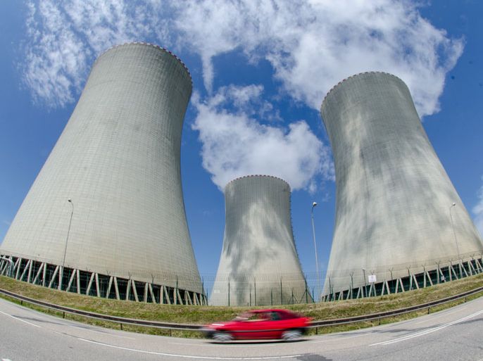 epa03277102 A car drives pass in front of the cooling towers of the nuclear power plant in Temelin, Czech Republic, 22 June 2012. Supporters and opponents of nuclear power are currently discussing the expansion of the Temelin nuclear power plant. The nuclear power plant is to be extended by two pressurized water reactors until 2025. EPA/ARMIN WEIGEL