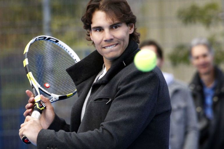 epa03489495 Spanish tennis player Rafael Nadal attends the opening of the 100th tennis playground of the Richard Krajicek Foundation in Rotterdam, The Netherlands, 28 November 2012. With the playgrounds the foundation of the former Dutch tennis player offers a place to play tennis for the underprivileged children in run-down suburbs. EPA/BAS CZERWINSKI