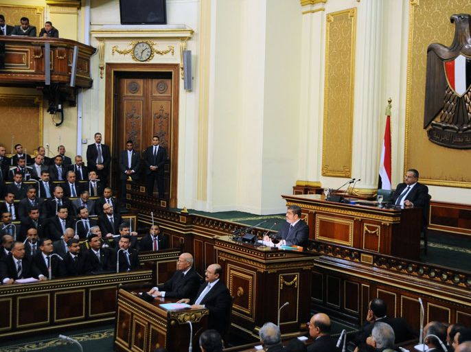 KLD312 - Cairo, -, EGYPT : A hand out picture released by Egyptian Presidency shows Egyptian President Mohamed Morsi (2R) giving a speech before the newly empowered senate in Cairo on December 29, 2012. In the address Morsi said a disputed new constitution guaranteed equality for all Egyptians, and downplayed the country's economic woes. AFP PHOTO/HO/EGYPTIAN PRESIDENCY == RESTRICTED TO EDITORIAL USE - MANDATORY CREDIT "AFP PHOTO / HO / EGYPTIAN PRESIDENCY" - NO MARKETING NO ADVERTISING CAMPAIGNS - DISTRIBUTED AS A SERVICE TO CLIENTS ==