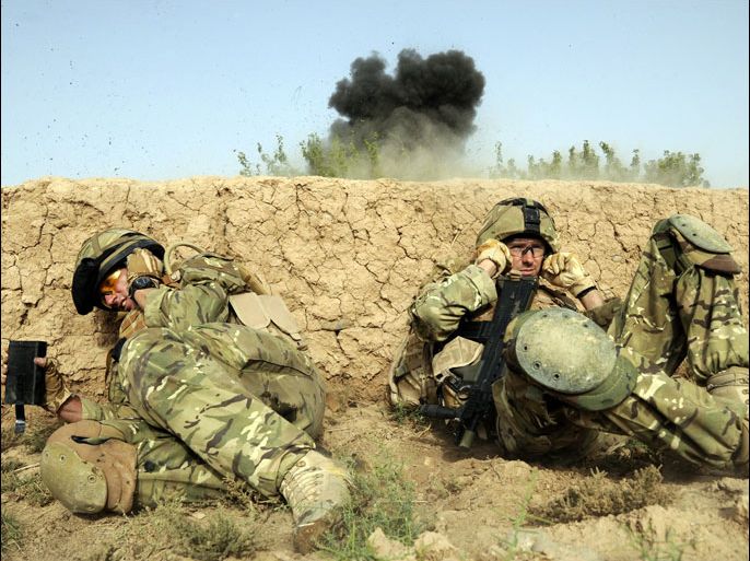 (FILES) In this handout photograph released by The Ministry of Defence on August 1, 2010, British soldiers serving with Somme Company, the 1st Battalion The Duke of Lancaster's Regiment take cover as they shelter from a controlled explosion of an Improvised Explosive Device (IED) in a village of Sayedebad District, Nad e Ali, Helmand Province on July 31, 2010, on the second day of Operation Tor Shezada. Britain will announce a new withdrawal of troops from Afghanistan on December 19, 2012, officials said, with media reports saying that around 4,000 soldiers are to be brought home next year. Prime Minister David Cameron is expected to outline plans to lawmakers in parliament that would nearly half Britain's force in Afghanistan, which is currently around 9,000-strong. -----EDITORS NOTE---- RESTRICTED TO EDITORIAL USE - MANDATORY CREDIT "AFP PHOTO/MINISTRY OF DEFENCE/Corporal Barry LLOYD RLC/FILES" - NO MARKETING NO ADVERTISING CAMPAIGNS - DISTRIBUTED AS A SERVICE TO CLIENTS