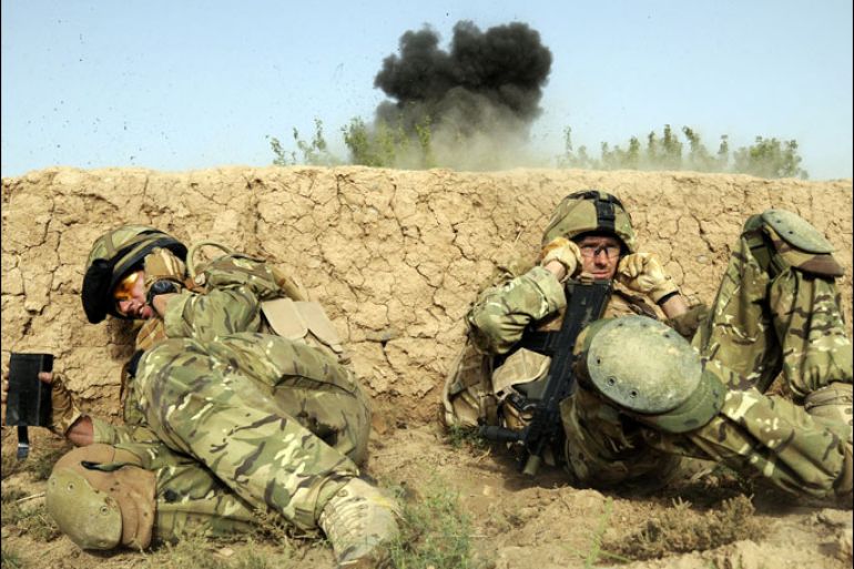 (FILES) In this handout photograph released by The Ministry of Defence on August 1, 2010, British soldiers serving with Somme Company, the 1st Battalion The Duke of Lancaster's Regiment take cover as they shelter from a controlled explosion of an Improvised Explosive Device (IED) in a village of Sayedebad District, Nad e Ali, Helmand Province on July 31, 2010, on the second day of Operation Tor Shezada. Britain will announce a new withdrawal of troops from Afghanistan on December 19, 2012, officials said, with media reports saying that around 4,000 soldiers are to be brought home next year. Prime Minister David Cameron is expected to outline plans to lawmakers in parliament that would nearly half Britain's force in Afghanistan, which is currently around 9,000-strong. -----EDITORS NOTE---- RESTRICTED TO EDITORIAL USE - MANDATORY CREDIT "AFP PHOTO/MINISTRY OF DEFENCE/Corporal Barry LLOYD RLC/FILES" - NO MARKETING NO ADVERTISING CAMPAIGNS - DISTRIBUTED AS A SERVICE TO CLIENTS