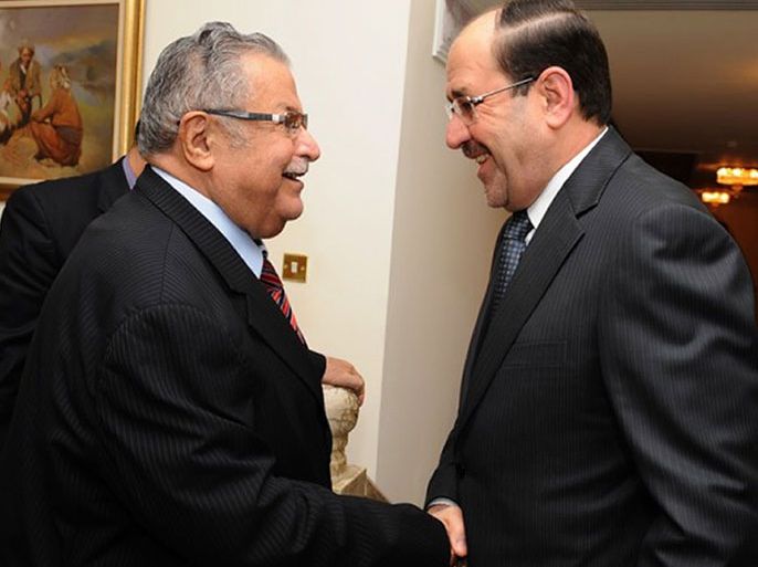 BGW01 - Baghdad, -, IRAQ : A handout picture released by the Iraqi prime minister's office on December 18, 2012 shows Iraqi Premier Nuri al-Maliki (R) welcoming President Jalal Talabani at his ofice in Baghdad the previous day. Talabani, a former Kurdish rebel who became a major player in Iraqi politics and worked to reconcile its feuding leaders, was in hospital on December 18 after what state television said was a stroke. AFP PHOTO / HO / PRIME MINISTER'S OFFICE == RESTRICTED TO EDITORIAL USE - MANDATORY CREDIT "AFP PHOTO / HO / PRIME MINISTER'S OFFICE" - NO MARKETING NO ADVERTISING CAMPAIGNS - DISTRIBUTED AS A SERVICE TO CLIENTS ==