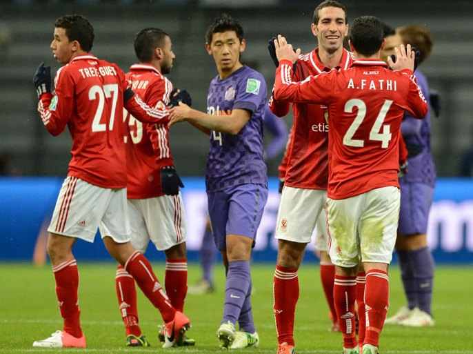 Egypy's Al-Ahly forward Mohamed Aboutrika (2nd R) celebrates his team's victory over Japan's San Frecce Hiroshima with midfielder Ahmed Fathi (R-#24) after their 2012 Club World Cup quarter-final football match in Toyota on December 9, 2012. Al-Ahly won the match 2-1. AFP PHOTO / TOSHIFUMI KITAMURA