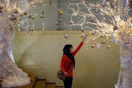 An Indonesian Muslim girl touches Christmas decorations at a shopping mall in Jakarta, Indonesia, 20 December 2012. Business centers and shopping malls were decorated for the upcoming Christmas celebrations. EPA/MAST IRHAMAn Indonesian Muslim girl touches Christmas decorations at a shopping mall in Jakarta, Indonesia, 20 December 2012. Business centers and shopping malls were decorated for the upcoming Christmas celebrations. EPA/MAST IRHAM