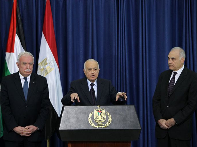 Arab League Secretary General Nabil al-Arabi (C) speaks as Egypt's Foreign Minister Mohamed Kamal Amr (R) and Palestinian Foreign Minister Riyad al-Malki (L) listen on during a press conference following their arrival in the West Bank city of Ramallah for a meeting with Palestinian president Mahmud Abbas on December 29, 2012. AFP PHOTO/ABBAS MOMANI
