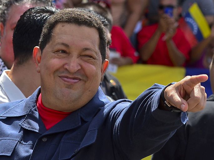Venezuelan President Hugo Chavez gestures before voting in Caracas on October 07, 2012. Venezuelans voted Sunday with President Hugo Chavez's 14-year socialist revolution on the line as the leftist leader faced youthful rival Henrique Capriles in his toughest electoral challenge yet. AFP PHOTO/Luis Acosta