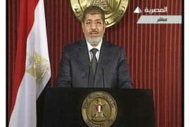 An image grab taken from Egyptian state TV shows Egyptian President Mohamed Morsi as he gives an address in Cairo on December 6, 2012, in his first speech since bloody street clashes between his supporters and opponents. AFP PHOTO/EGYPTIAN TV ==RESTRICTED TO EDITORIAL USE - MANDATORY CREDIT "AFP PHOTO / EGYPTIAN TV" - NO MARKETING NO ADVERTISING CAMPAIGNS - DISTRIBUTED AS A SERVICE TO CLIENTS ==