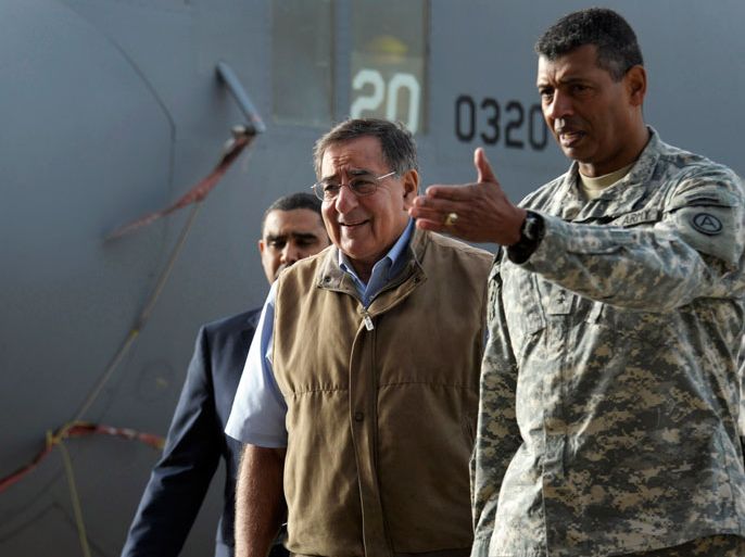 US Defense Secretary Leon Panetta (C) walks with Commanding General of US Army Central Command Army Lt. Gen. Vincent Brooks (R) upon his arrival at Ali Al-Salem Air Base in Kuwait City on December 12, 2012. The United States plans to deploy a majority of its naval fleet to the Asia-Pacific along with other advanced weaponry but Panetta insisted that a robust American force would remain in place in the Middle East. AFP PHOTO/SUSAN WALSH-POOL