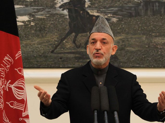 epa03501119 Afghan President Hamid Karzai speaks during a press conference at Presidential Palace in Kabul, Afghanistan, 08 December 2012. Reports state that Afghan President Hamid Karzai on 08 December said that a suicide attack that wounded the National Directorate of Security, Asadullah Khalid the country's intelligence chief was planned in neighboring Pakistan. Asadullah Khalid was injured in suicide bomb blast on 06 December at a guesthouse where he was reportedly meeting some individuals. EPA/S. SABAWOON