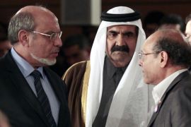 epa03059637 Tunisian President Moncef Marzouki (R), Prime Minister Hamadi Jebali (L) and Emir of Qatar Sheikh Hamad bin Khalifa al-Thani (C) talk during a celebration to mark the first anniversary of the removal of ousted president Zine El Abidine Ben Ali, in Tunis, Tunisia, 14 January 2012. Tunisians mark the first anniversary of the fall of dictator Ben Ali and take stock following a year of mixed blessings for the country that led the Arab world down the road of revolution. On 14 January 2011, Ben Ali and his wife went into exile in Saudi Arabia after a month of protests over his corrupt, repressive 23-year rule that unleashed a wave of uprisings across the region. EPA/STRINGER