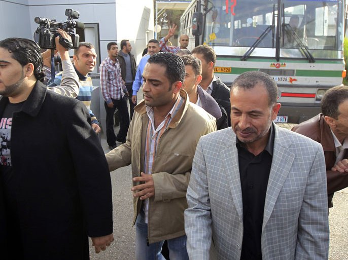 Palestinian members of the Fatah party arrive at the Rafah crossing with Egypt in the southern Gaza Strip on December 3, 2012. Seventeen members of Palestinian leader Mahmud Abbas' Fatah faction, which rules the West Bank, who left the Gaza Strip after the Hamas take over in 2007