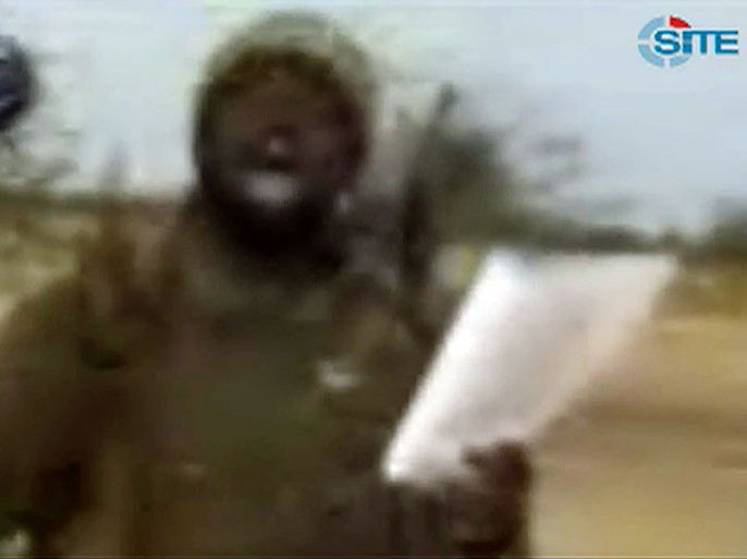 A picture taken from a video released by SITE Intelligence on November 29, 2012 reportedly shows Abubakar Shekau, the suspected leader of Nigerian Islamist extremist group Boko Haram, speaking in an undisclosed place. The leader of Nigeria's Boko Haram has expressed solidarity with global jihadists, saying the US and Britain "should witness that we are with our mujahideen brothers," in a video posted Thursday, SITE said. According to SITE Intelligence Group, a US-based organisation, Abubakar Shekau gave the speech in Arabic in a 39-minute video posted to jihadist forums. It was not clear when it was recorded.