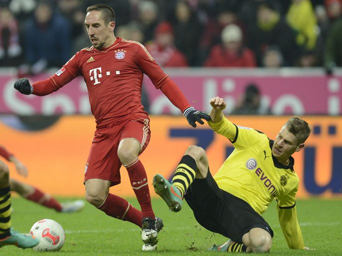 Bayern Munich's French midfielder Franck Ribery (L) and Dortmund's Polish defender Lukas Piszczek vie for the ball during the German first division Bundesliga match between Bayern Munich and Borussia Dortmund in the stadium in Munich, southern Germany, on December 1, 2012. The match ended 1-1 draw. AFP PHOTO/CHRISTOF STACHE