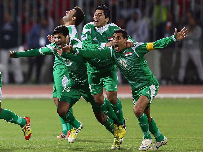 Iraqi players celebrate after winning over Bahrain in penalty shoot-out during their semi final match in the 21st Gulf Cup in Manama, January 15, 2013. Iraq will meet United Arab Emirates in the final. AFP PHOTO/MARWAN NAAMANI