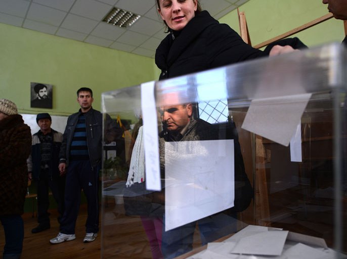 A woman casts her vote during the national referendum in the town of Belene on January 27, 2013. Bulgarians voted Sunday on whether to revive plans ditched by the government to construct a second nuclear power plant, in the EU member's first referendum since communism. The referendum asks 6.9 million eligible voters: "Should Bulgaria develop nuclear energy by constructing a new nuclear power plant
